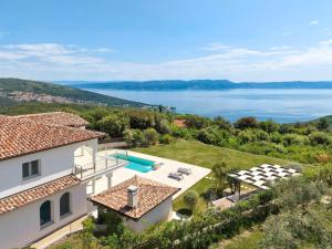 an aerial view of a villa with a swimming pool at Luxury Panorama Vila with amazing Seaview in Gondolici 7 km from Rabac in Labin