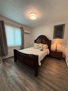 a bedroom with a large bed and a window at Monterosso By Cinque Terre in Isabela