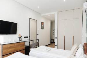 Televisi dan/atau pusat hiburan di Select Hotel