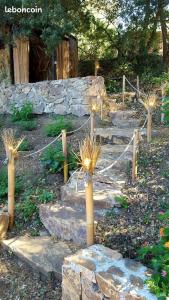 a set of stone stairs with lights on them at chambre hote independante in Le Mas-dʼAzil