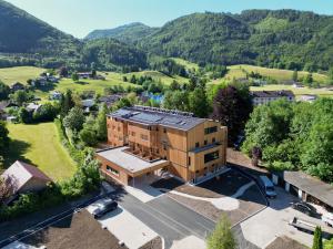 an aerial view of a building with mountains in the background at Haus der Achtsamkeit in Grünau im Almtal