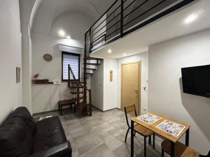 a living room with a couch and a table at Largo Otranto - Guest House in Brindisi