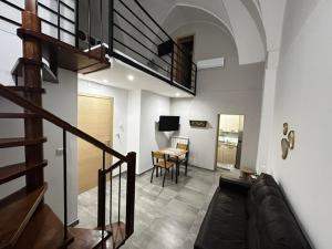 a living room with a couch and a table at Largo Otranto - Guest House in Brindisi