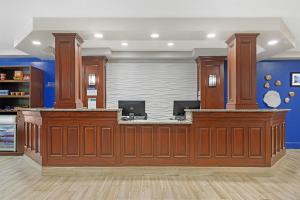a lobby with a large wooden counter in a room at Best Western Plus Brunswick Bath in Brunswick +59 photos