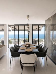 a dining room with a table and some chairs at Villa de Anna in Adeje