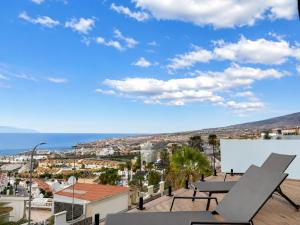 a view of the ocean from the balcony of a house at Villa de Anna in Adeje