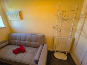a living room with a couch in the corner of a room at Castle View Dover in Dover +11 photos