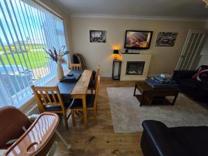 a living room with a table and a couch at Castle View Dover in Dover