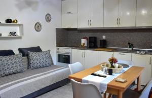 a living room with a couch and a table at Lazatka in Samothraki