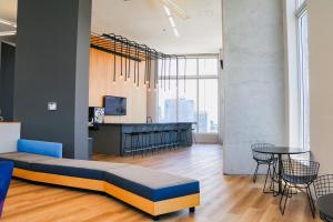 a living room with a bed and a table at Modern Studio by Brickell & Beach in Miami