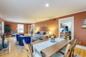 a dining room and living room with a table and chairs at Salisbury Waterfront: Schumaker Pond Paradise! in Salisbury