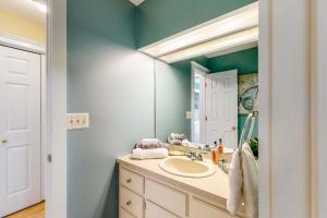 a bathroom with a sink and a mirror at Salisbury Waterfront: Schumaker Pond Paradise! in Salisbury +30 photos
