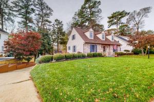 a white house with a lawn in front of it at Salisbury Waterfront: Schumaker Pond Paradise! in Salisbury