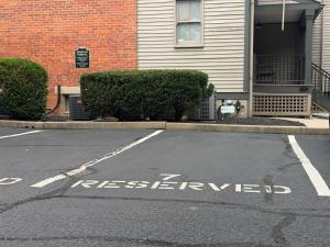 an empty parking lot in front of a house at Walk to Stadiums & Downtown, Jet Tub, Historic Apt in Covington