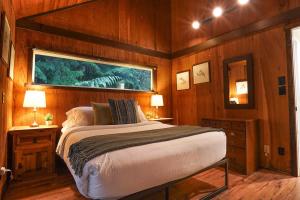 a bedroom with a bed and a window in it at Little Haven Cottage in Glacier