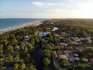 an aerial view of a town next to the ocean at Encanto na Mata in Mata de Sao Joao