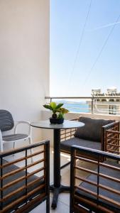a room with a table and chairs on a boat at O'Det Luxury Rooms & Apartments in Sarandë