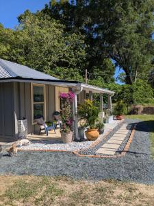 a house with a cat sitting in front of it at Country side house with with cozy 3 bedrooms and 2 bath in Minneola