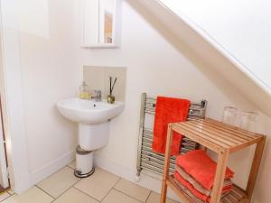 a bathroom with a sink and a toilet and a sink at St Kilda in Ballater +28 photos