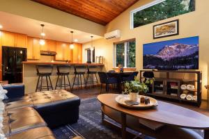 a living room with a couch and a table at Timberline Terrace in Glacier