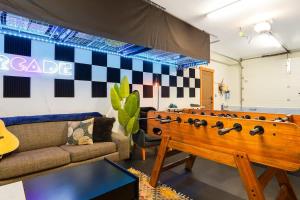 a living room with a large pool table at Timberline Terrace in Glacier