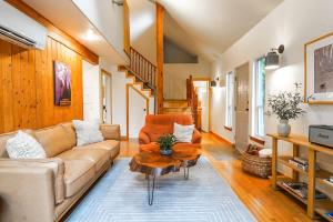 a living room with a couch and a table at Colfax Cabin in Glacier