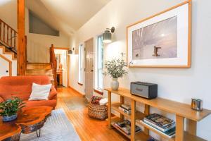 a living room with a couch and a table at Colfax Cabin in Glacier +18 photos