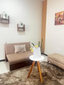 a living room with a couch and a table at Garzonier vacacional in Sucre +3 photos
