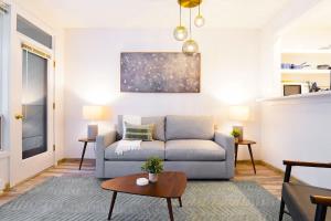 a living room with a couch and a table at Twin Lakes Retreat in Glacier