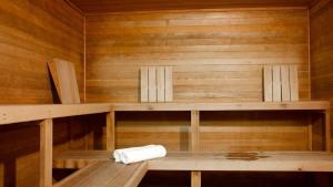 a sauna with wooden walls and shelves and a towel at Cascade Peaks in Glacier