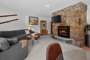 a living room with a couch and a fireplace at Winter Park Place #18 in Winter Park