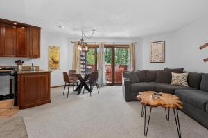 a living room with a couch and a table at Winter Park Place #18 in Winter Park