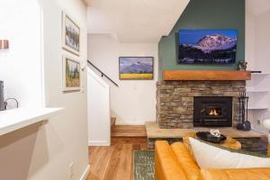a living room with a couch and a fireplace at Crystal Creek Retreat in Bellingham