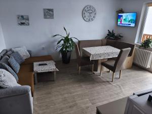 a living room with a couch and a table at Apartmán Jarka in Bodice