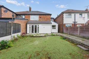 a garden in the backyard of a house at Spacious Modern home in the heart of Whitefield - Private Driveway Parking in Whitefield