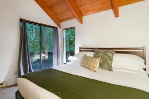 a bedroom with a bed and a large window at Skywood in Deming +49 photos