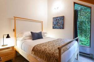 a bedroom with a large bed and a window at Skywood in Deming