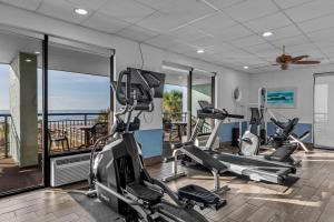 a gym with two treadmills and cardio machines at Monterey Bay Suites in Myrtle Beach