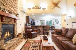 a living room with a couch and a fireplace at Hearthstone in Deming