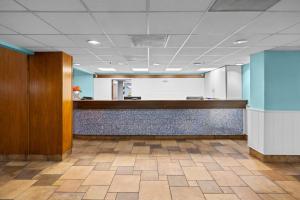 an office lobby with a reception desk and a counter at Monterey Bay Suites in Myrtle Beach