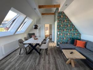 a living room with a couch and a table at Astrid's Appartements in Winterberg