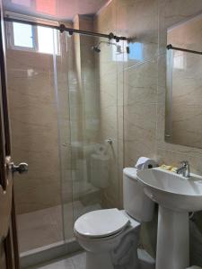 a bathroom with a shower and a toilet and a sink at Hotel Sunset Beach in Cartagena de Indias +65 photos