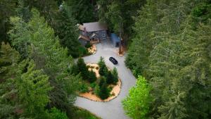 an aerial view of a house in the middle of a river at Evergreen Lodge in Deming
