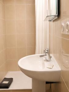 a bathroom with a sink and a shower at La Diligence in Lepin-le-Lac +35 photos
