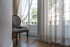 Een balkon of terras bij Casa das Palmeiras Charming House - Azores 1901