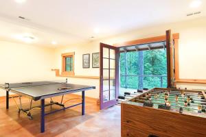 a room with a ping pong table in front at The Shuksan in Deming