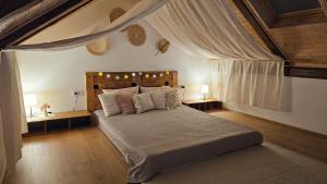 a bedroom with a large bed in a room at Apartments Beck - Super Central in Sombor