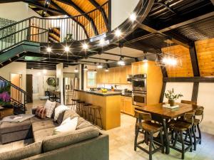 a living room with a couch and a table at Alpine Lodge in Glacier +37 photos