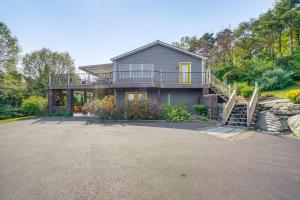 a large house with a balcony and a driveway at Hudson Valley Multi-Unit Escape: Secluded + Scenic in Claverack