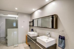 a bathroom with two sinks and a mirror at Hudson Valley Multi-Unit Escape: Secluded + Scenic in Claverack +47 photos